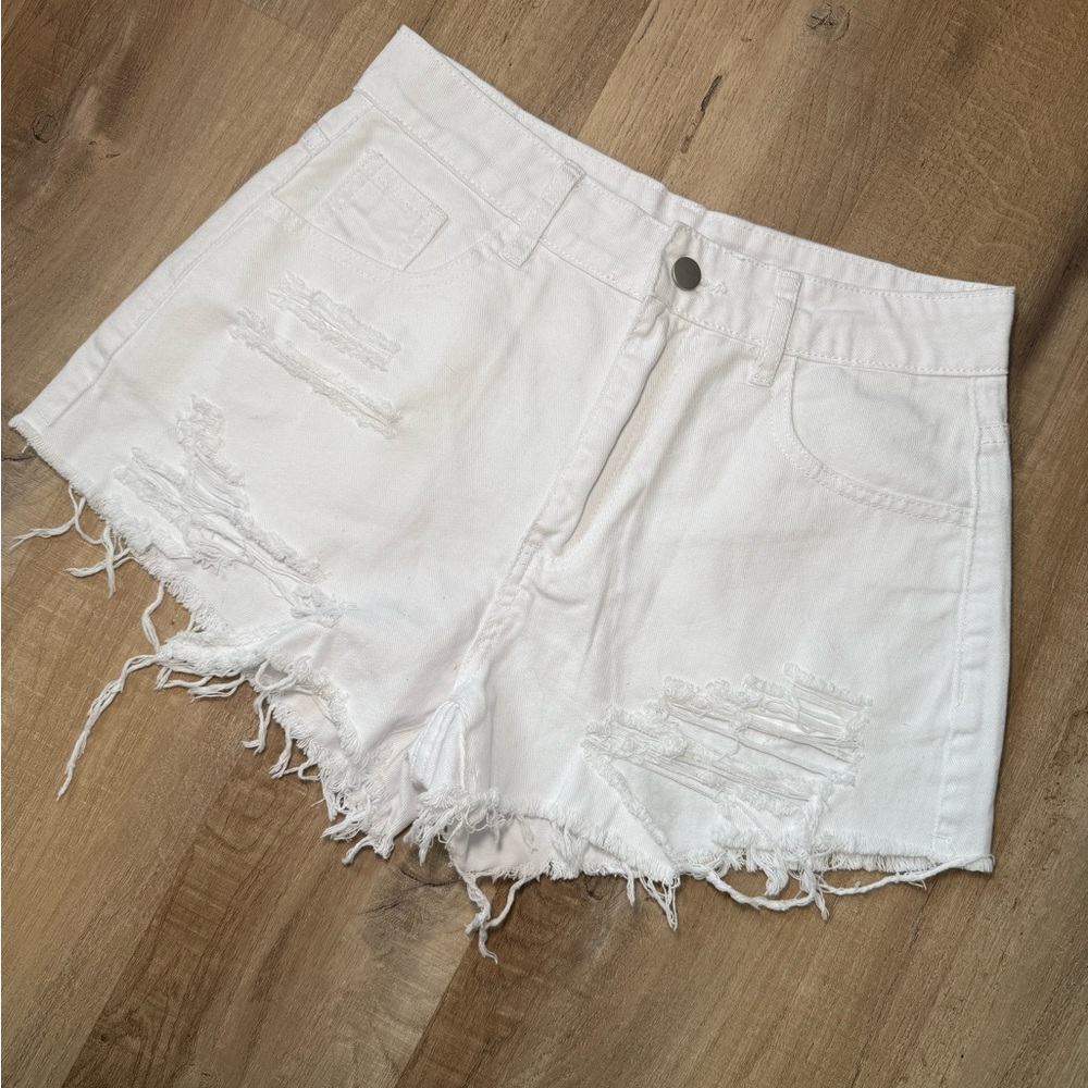 White ripped denim shorts